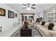 Inviting living room features views of the kitchen, stylish decor, and comfortable seating at 9900 Ne 20 Terrace Rd, Anthony, FL 32617