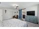 Bright main bedroom with barn door leading to main bath at 9900 Ne 20 Terrace Rd, Anthony, FL 32617