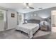 Spacious main bedroom featuring soft gray walls and plush carpeting at 9900 Ne 20 Terrace Rd, Anthony, FL 32617