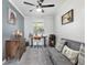 Versatile home office space with cozy seating, a decorative painting, and neutral decor at 9900 Ne 20 Terrace Rd, Anthony, FL 32617