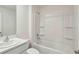 Well-lit bathroom with a shower-tub combination, ample shelving, and modern fixtures, providing a comfortable and functional space at 13032 Sw 84Th Terrace Rd, Ocala, FL 34473