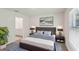 Cozy bedroom with a comfortable bed, stylish decor, and ensuite bathroom at 13032 Sw 84Th Terrace Rd, Ocala, FL 34473