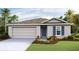 Charming single-Gathering home featuring a two-car garage, manicured lawn, and a welcoming front entrance at 13032 Sw 84Th Terrace Rd, Ocala, FL 34473