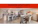 Bright kitchen featuring a center island with barstool seating and stainless steel appliances at 13032 Sw 84Th Terrace Rd, Ocala, FL 34473