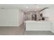 Spacious open-concept living area with tiled floors, connecting the living area with kitchen at 13032 Sw 84Th Terrace Rd, Ocala, FL 34473