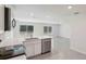 Bright living space featuring durable floors, stainless steel appliances, and natural light at 13032 Sw 84Th Terrace Rd, Ocala, FL 34473