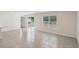 Bright living room with sliding glass doors, neutral walls, and easy-to-clean floors at 13032 Sw 84Th Terrace Rd, Ocala, FL 34473