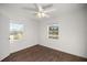 Inviting bedroom featuring stylish flooring, ceiling fan, and windows offering a pleasant outdoor view at 1309 Ne 33Rd St, Ocala, FL 34479
