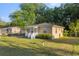 Quaint single-story home with a white picket fence, freshly cut lawn, and charming curb appeal at 1309 Ne 33Rd St, Ocala, FL 34479