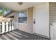 Welcoming front porch with a white picket fence and a secure front door with a modern lock system at 1309 Ne 33Rd St, Ocala, FL 34479