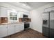 Kitchen featuring stainless steel appliances, butcher block countertops, and white cabinets at 1309 Ne 33Rd St, Ocala, FL 34479