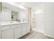 Bright main bathroom with double sink vanity, large mirror, and large walk-in shower at 16102 Sw 27Th Terrace Rd, Ocala, FL 34473