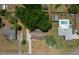 An aerial view of the property showcasing the house, yard, surrounding neighborhood, and a community pool at 164 Ne 53Rd St, Ocala, FL 34479
