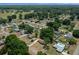 Expansive aerial view of a residential neighborhood with lush greenery and well-maintained homes at 164 Ne 53Rd St, Ocala, FL 34479