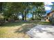 Spacious backyard featuring mature trees and a storage shed at 164 Ne 53Rd St, Ocala, FL 34479