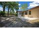A partial view of the backyard with partial fencing and mature trees at 164 Ne 53Rd St, Ocala, FL 34479