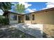Backyard with a concrete patio and views of the sunroom at 164 Ne 53Rd St, Ocala, FL 34479