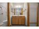 Bathroom showcasing a vanity, a mirror, a shower, and tiled walls at 164 Ne 53Rd St, Ocala, FL 34479