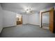 Spacious bedroom with a ceiling fan, carpet flooring, and access to the ensuite bathroom at 164 Ne 53Rd St, Ocala, FL 34479