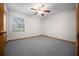 Bright bedroom with a window that offers an outside view, ceiling fan, and a closet at 164 Ne 53Rd St, Ocala, FL 34479