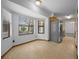 Dining area with large windows providing ample natural light, complemented by tile flooring at 164 Ne 53Rd St, Ocala, FL 34479