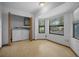 Bright laundry room with a washer, dryer, and natural light from the two windows at 164 Ne 53Rd St, Ocala, FL 34479