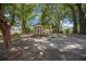 Backyard featuring a storage shed and metal swing set at 164 Ne 53Rd St, Ocala, FL 34479