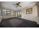 Enclosed sunroom featuring a ceiling fan, and sliding glass door access to the backyard at 164 Ne 53Rd St, Ocala, FL 34479