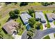 Aerial view of a neighborhood featuring homes with pools, well-maintained lawns, and mature landscaping at 1763 Sw 155Th Place Rd, Ocala, FL 34473