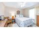 Nautical themed bedroom with a ceiling fan, wood-look floors, and white walls at 1763 Sw 155Th Place Rd, Ocala, FL 34473
