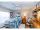 Charming bedroom featuring light-colored walls, wood-look floors, and a ceiling fan at 1763 Sw 155Th Place Rd, Ocala, FL 34473