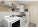 Laundry room with a washer and dryer, sink, and storage shelves at 1763 Sw 155Th Place Rd, Ocala, FL 34473