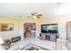 Inviting living room with plush seating, a large TV, and access to other areas of the home at 1763 Sw 155Th Place Rd, Ocala, FL 34473