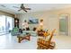 Cozy living room featuring tile floors, a ceiling fan, and comfortable seating arrangements at 1763 Sw 155Th Place Rd, Ocala, FL 34473