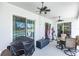 Covered patio features ceiling fans, outdoor seating, and view of the pool and backyard at 1763 Sw 155Th Place Rd, Ocala, FL 34473