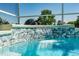 The pool has a tile waterfall feature with a sculpted turtle creating a relaxing atmosphere at 1763 Sw 155Th Place Rd, Ocala, FL 34473