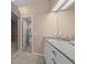 Bathroom showcasing a double vanity and walk-in closet at 2343 Se 19Th Cir, Ocala, FL 34471