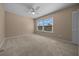 Bedroom with a ceiling fan and large window providing natural light at 2343 Se 19Th Cir, Ocala, FL 34471