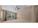 Bright bedroom features a ceiling fan, a large window offering natural light, and neutral color walls at 2343 Se 19Th Cir, Ocala, FL 34471