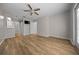 Spacious bedroom with vinyl floors, barn door closets, and ceiling fan at 2343 Se 19Th Cir, Ocala, FL 34471