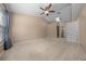 Bright bedroom features a ceiling fan, a large window offering natural light, and neutral color walls at 2343 Se 19Th Cir, Ocala, FL 34471