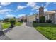 Street view of the home featuring an attached garage, landscaping, and brick chimney at 2343 Se 19Th Cir, Ocala, FL 34471