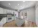 Updated kitchen featuring an island with granite countertops and stainless steel appliances at 2343 Se 19Th Cir, Ocala, FL 34471