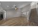 Spacious living room featuring a fireplace, high ceilings, hardwood floors, and staircase at 2343 Se 19Th Cir, Ocala, FL 34471