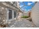 Private covered patio with pavers, synthetic grass, and stylish string lights for outdoor relaxation at 2343 Se 19Th Cir, Ocala, FL 34471