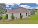 Well-maintained backyard featuring a screened-in porch and manicured landscaping and spacious lawn at 2369 Nw 53Rd Avenue Road, Ocala, FL 34482