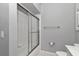 The bathroom includes a glass-enclosed shower and a white toilet and vanity at 2369 Nw 53Rd Avenue Road, Ocala, FL 34482