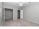 This bedroom features gray walls, carpet, white trim and a spacious closet at 2369 Nw 53Rd Avenue Road, Ocala, FL 34482