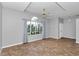 Spacious empty bedroom with a ceiling fan, recessed ceiling and a large window at 2369 Nw 53Rd Avenue Road, Ocala, FL 34482