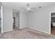 Spacious bedroom featuring plush carpeting and a ceiling fan at 2369 Nw 53Rd Avenue Road, Ocala, FL 34482